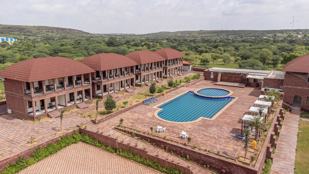 Wide aerial view of The Gateway Osian pool and resort buildings