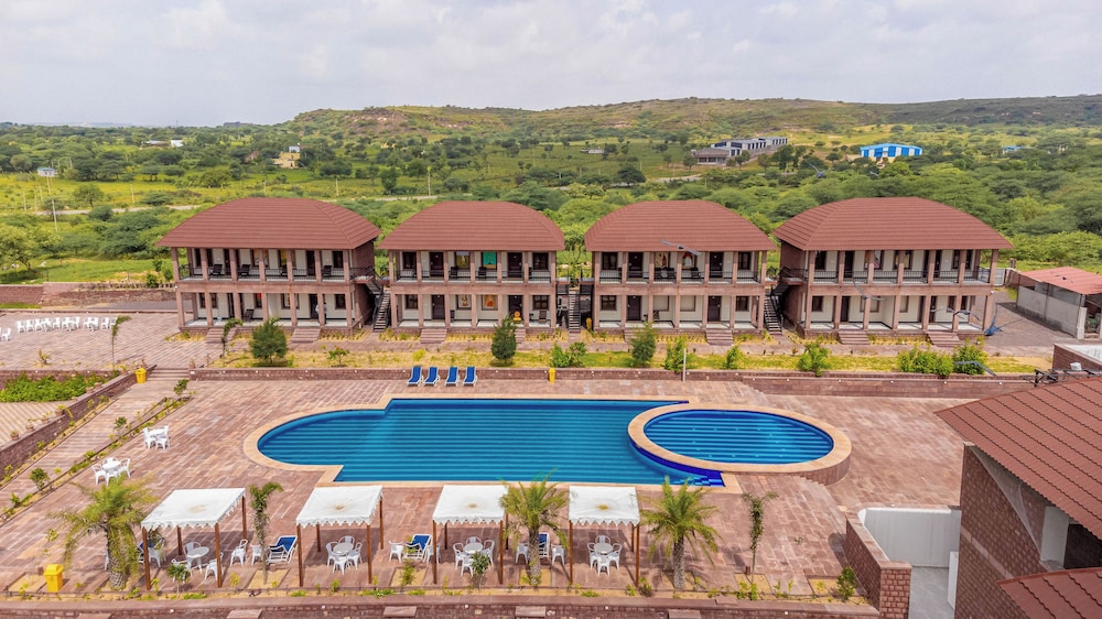 Pool and resort buildings at The Gateway Osian